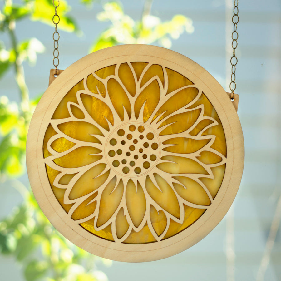 Large-stained-glass-and-wood-suncatcher-window-ornament-with-sunflower-cut-out-design-in-honey-yellow-color-hanging-in-window